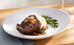 Seasons 52 signature dishes The menu changes four times a year, but staples include Cedar Plank-Roasted Salmon, Wood-Grilled Filet Mignon, and a selection of "Mini Indulgence" desserts.